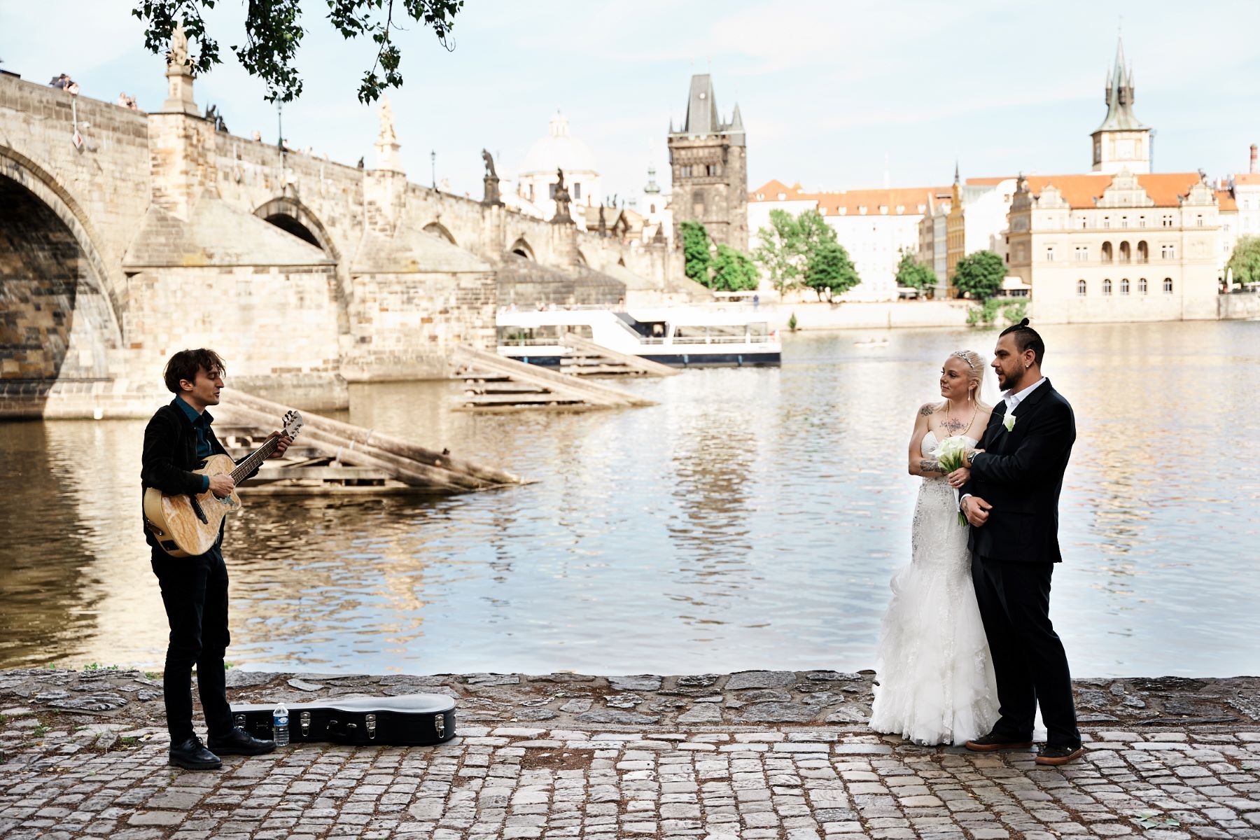 Loving couple enjoying a moment near Charles Bridge.