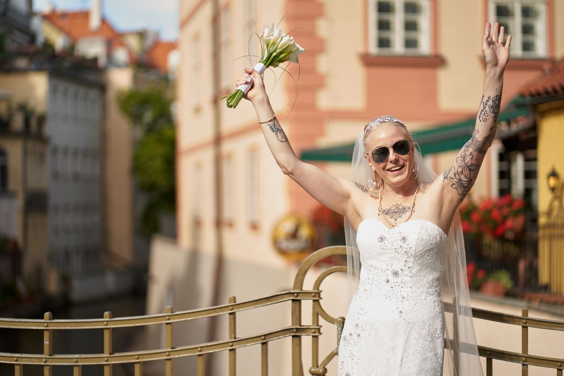 Romantic photoshoot of newlyweds near Charles Bridge.